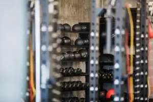 Medicine ball storage rack at EVOLVE Flagstaff with squat racks in the foreground