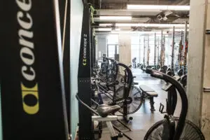 Row of Concept2 SkiErgs and Assault Air Bikes at EVOLVE Flagstaff gym in Flagstaff, Arizona